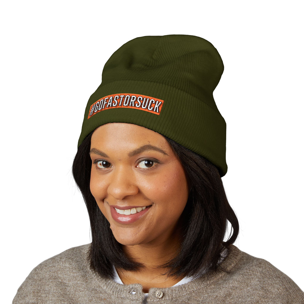 Person wearing a green beanie with text on a white background